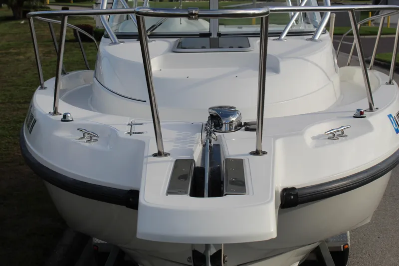 Slide: The Image of 2005 Boston Whaler 255 Conquest boat, front view with stainless steel railings. - 27