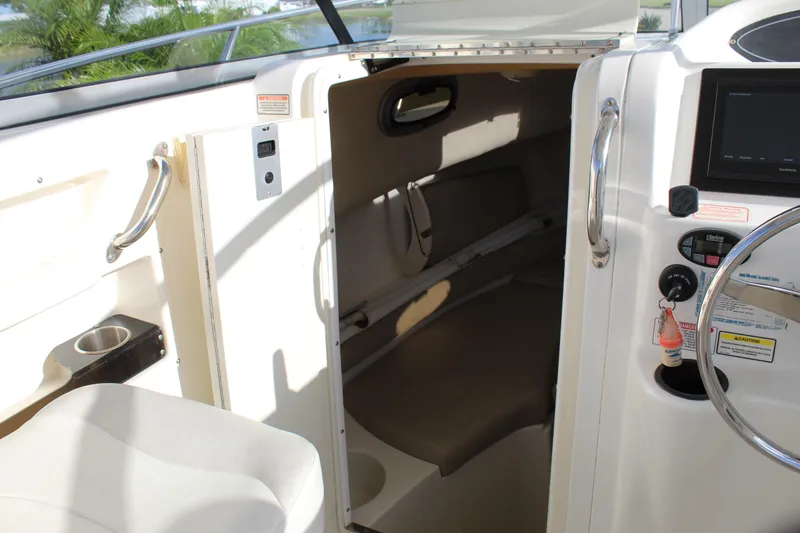 Slide: The Image of Interior view of a 2005 Boston Whaler 255 Conquest boat cabin and helm. - 39