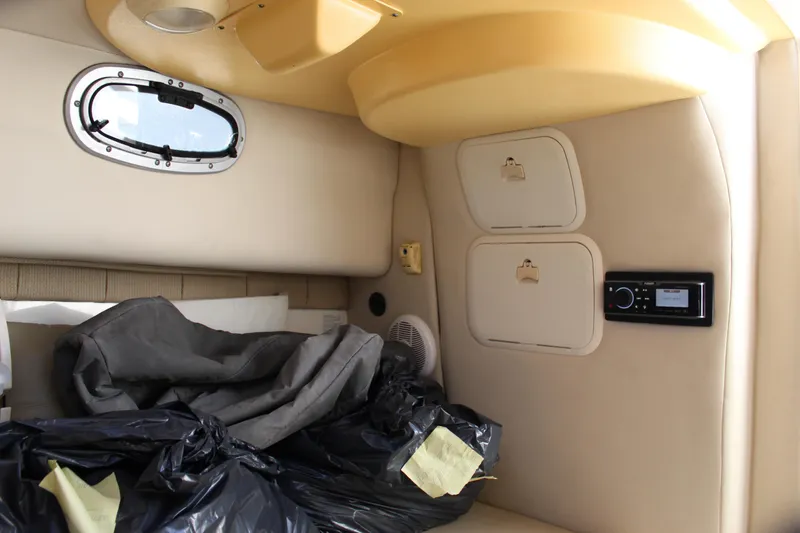 Slide: The Image of Interior cabin of 2005 Boston Whaler 255 Conquest with storage compartments and window. - 45