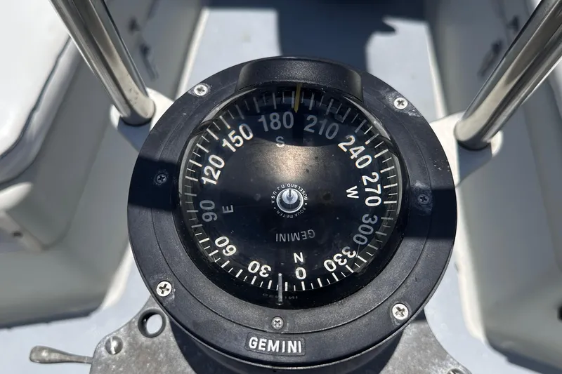 Slide: The Image of Compass on 1982 C&C 34 sailboat, displaying cardinal directions and degrees. - 10