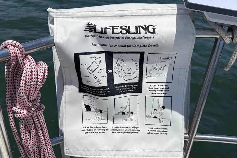 Slide: The Image of Lifesling overboard rescue system on a 1982 C&C 34 sailboat, with instructional diagrams. - 11