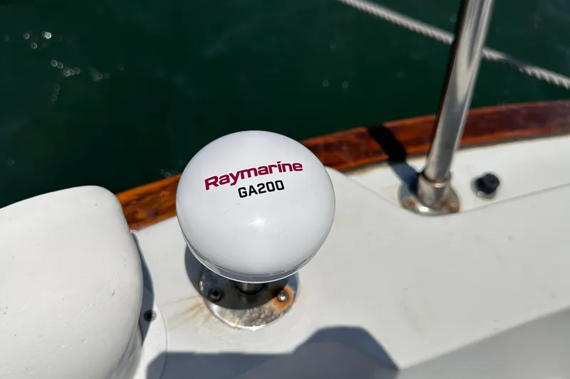 Slide: The Image of Raymarine GA200 antenna on 1982 C&C 34 sailboat deck, near railing. - 12