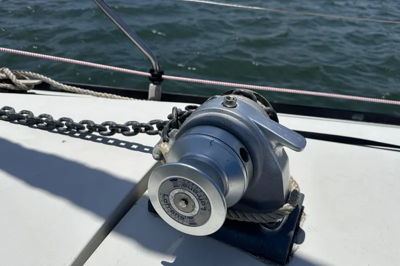 Slide: The Image of Winch on 1982 C&C 34 sailboat deck with ocean background. - 5