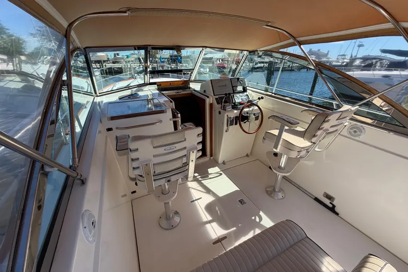 Slide: The Image of Interior view of a 2000 Sabreline 36 Express boat with helm and seating. - 10