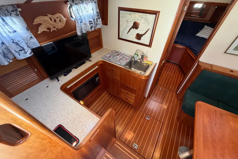 Slide: The Image of Interior of 2000 Sabreline 36 Express yacht with wood finish and modern amenities. - 17