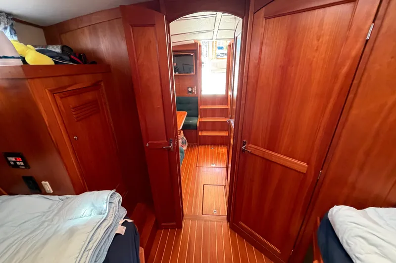 Slide: The Image of Interior of 2000 Sabreline 36 Express yacht with wooden paneling and cozy cabin layout. - 22