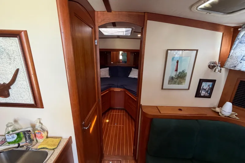 Slide: The Image of Interior of 2000 Sabreline 36 Express yacht with cozy cabin and nautical decor. - 24