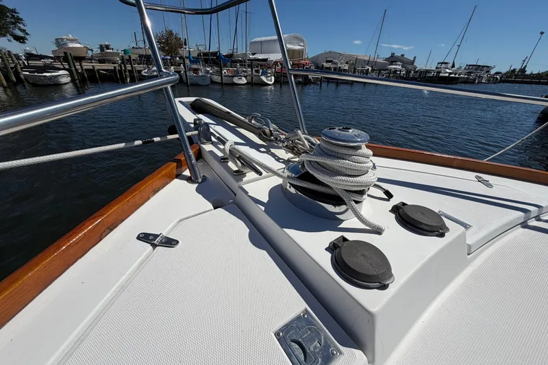 Slide: The Image of Bow of 2000 Sabreline 36 Express yacht with ropes and winch in marina. - 33