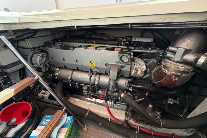 Slide: The Image of Engine compartment of a 2000 Sabreline 36 Express boat, showcasing detailed mechanical components. - 36