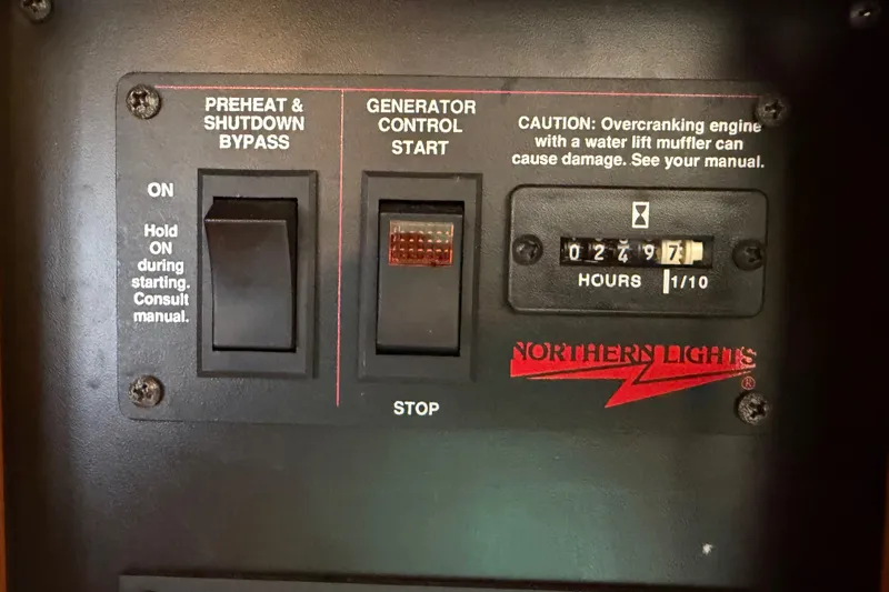 Slide: The Image of Control panel of a Northern Lights generator on a 2000 Sabreline 36 Express boat. - 38