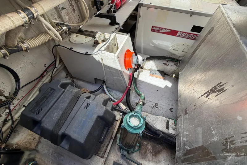 Slide: The Image of Engine compartment of 2000 Sabreline 36 Express with generator and battery setup. - 41