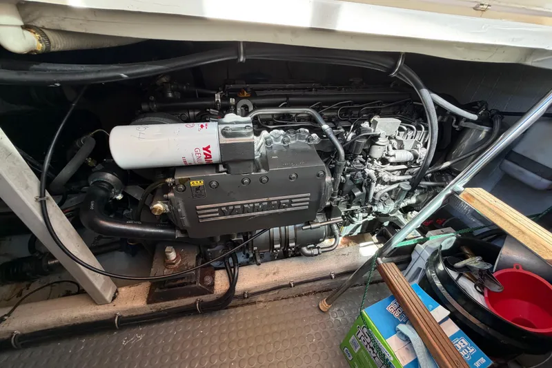 Slide: The Image of Engine compartment of a 2000 Sabreline 36 Express boat, featuring a Yanmar engine. - 35