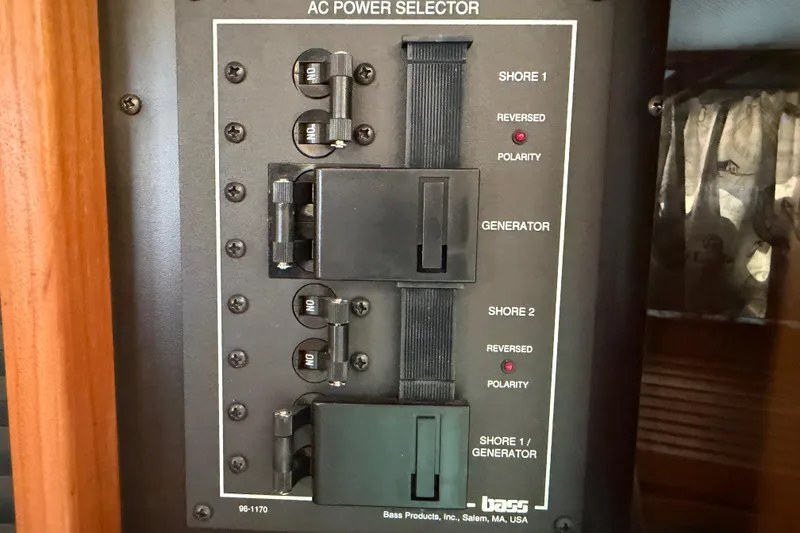 Slide: The Image of AC power selector panel on a 2000 Sabreline 36 Express boat. - 39