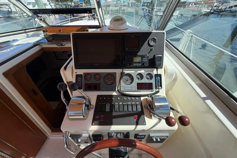Slide: The Image of Helm of 2000 Sabreline 36 Express boat with navigation controls and gauges. - 46