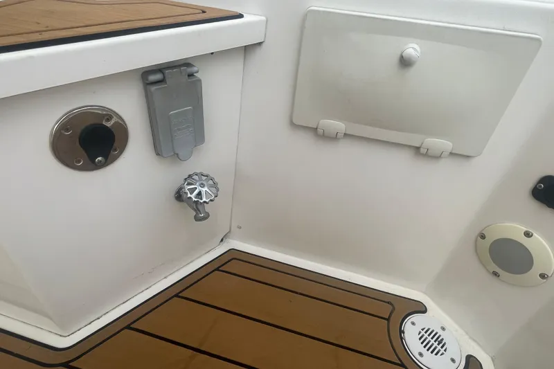 Slide: The Image of Interior view of a 2002 Canoe Cove 50 Pilothouse Yacht, featuring deck fittings and controls. - 10