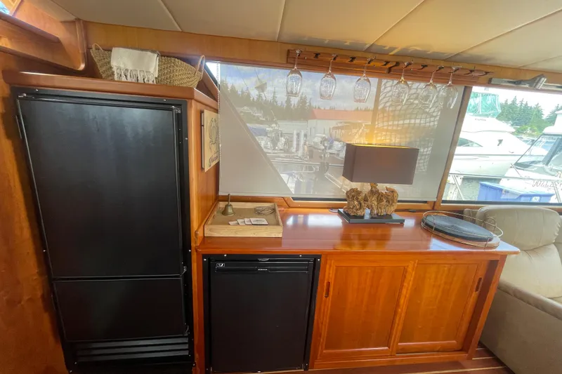 Slide: The Image of Interior of 2002 Canoe Cove 50 Pilothouse Yacht with elegant wood cabinetry and modern decor. - 23