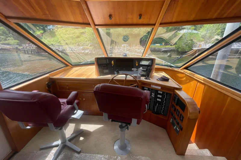 Slide: The Image of Pilothouse interior of 2002 Canoe Cove 50 Pilothouse Luxury Yacht with panoramic windows. - 27