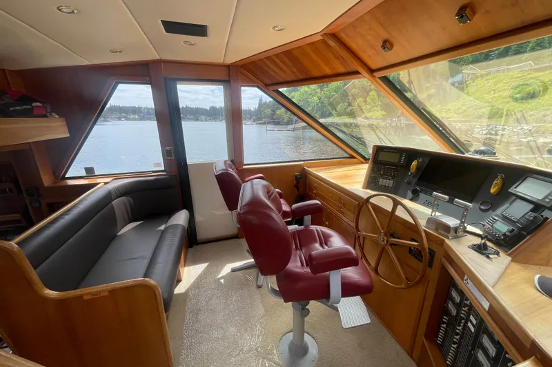 Slide: The Image of Pilothouse interior of 2002 Canoe Cove 50 Pilothouse Luxury Yacht with scenic water view. - 28