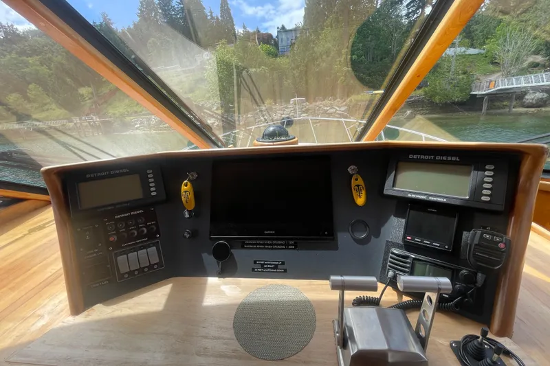 Slide: The Image of Pilothouse interior of 2002 Canoe Cove 50 Pilothouse Luxury Yacht with navigation controls. - 29