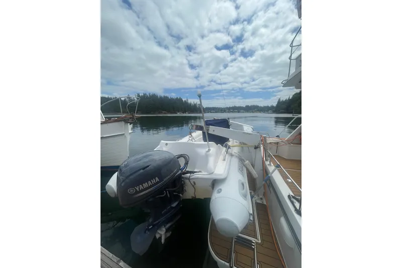 Slide: The Image of 2002 Canoe Cove 50 Pilothouse Luxury Yacht docked with Yamaha motor. - 3