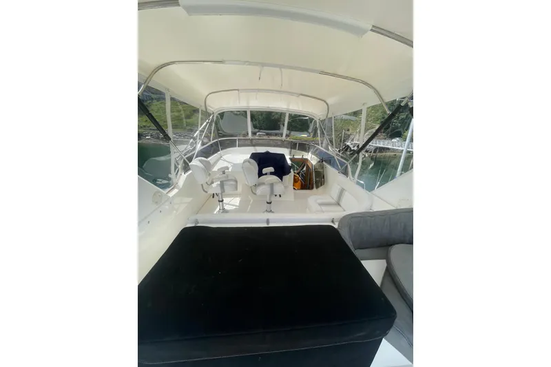Slide: The Image of Interior view of 2002 Canoe Cove 50 Pilothouse Luxury Yacht, featuring helm and seating area. - 35