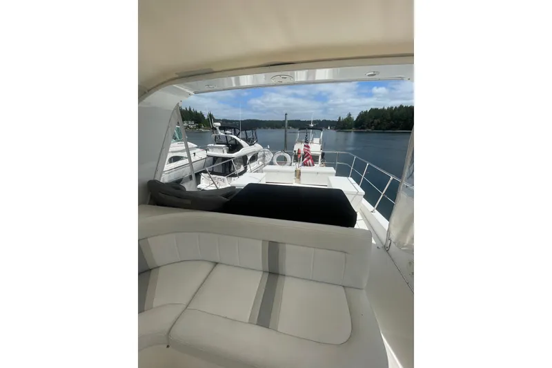 Slide: The Image of Luxurious 2002 Canoe Cove 50 Pilothouse Yacht with scenic waterfront view. - 36