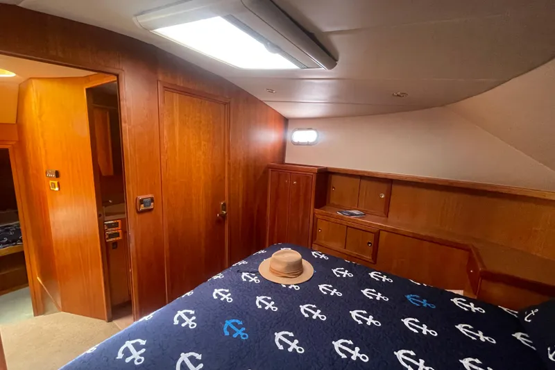 Slide: The Image of Luxurious cabin interior of 2002 Canoe Cove 50 Pilothouse Yacht with anchor-themed bedding. - 41