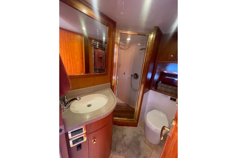 Slide: The Image of Luxurious bathroom in 2002 Canoe Cove 50 Pilothouse Yacht with shower and vanity. - 42