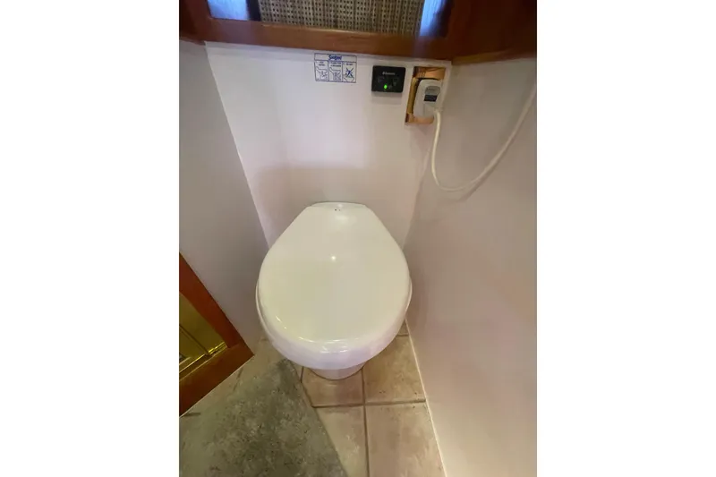 Slide: The Image of Luxury yacht bathroom with modern toilet, Canoe Cove 50 Pilothouse, 2002 model. - 43