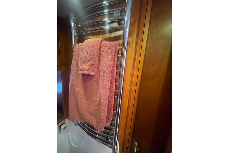 Slide: The Image of Towel hanging on a chrome rack inside a 2002 Canoe Cove 50 Pilothouse Luxury Yacht. - 44