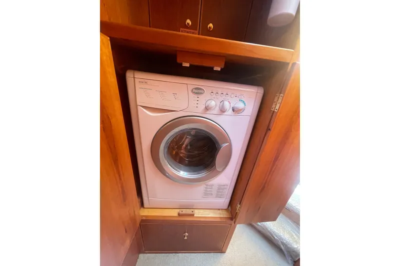 Slide: The Image of Washing machine in 2002 Canoe Cove 50 Pilothouse Luxury Yacht's wooden cabinet. - 46