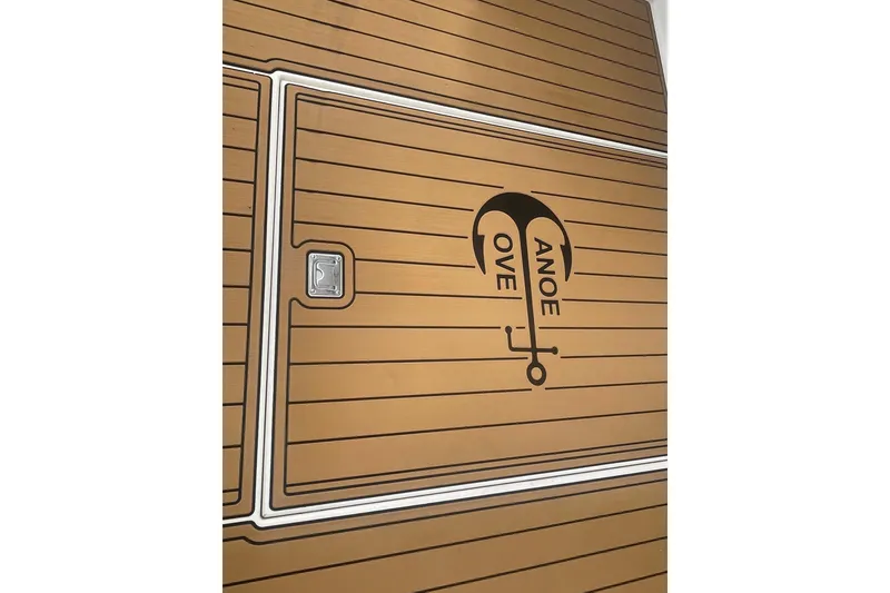 Slide: The Image of Teak deck of 2002 Canoe Cove 50 Pilothouse Luxury Yacht with logo. - 5