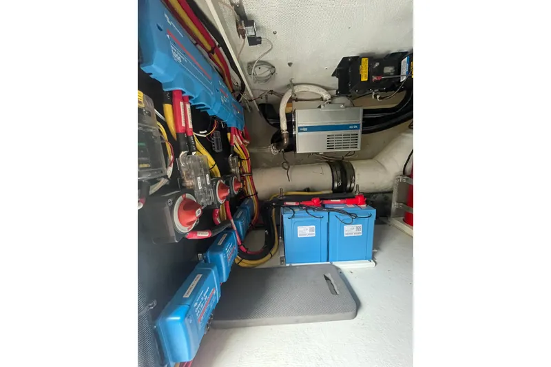 Slide: The Image of Electrical system of 2002 Canoe Cove 50 Pilothouse Luxury Yacht, featuring batteries and wiring. - 59