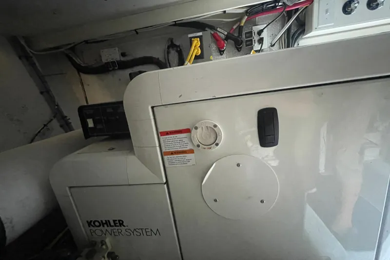 Slide: The Image of Kohler power system inside a 2002 Canoe Cove 50 Pilothouse Luxury Yacht. - 60