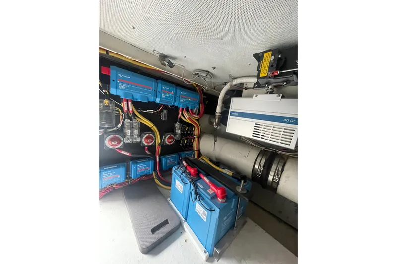 Slide: The Image of Electrical system of 2002 Canoe Cove 50 Pilothouse Luxury Yacht, featuring batteries and wiring. - 61