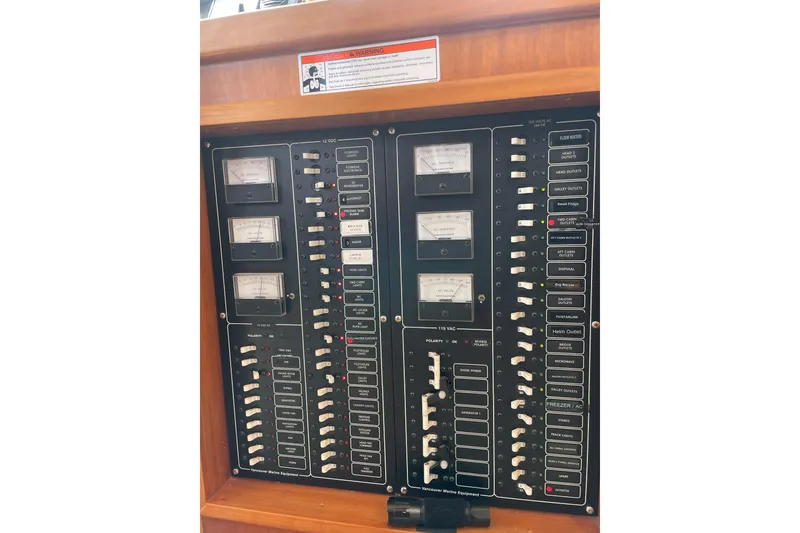 Slide: The Image of Electrical control panel on a 2002 Canoe Cove 50 Pilothouse Luxury Yacht. - 64