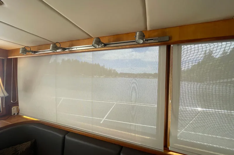 Slide: The Image of Interior view of 2002 Canoe Cove 50 Pilothouse Yacht with scenic window view. - 68