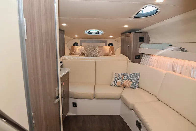Slide: The Image of Luxurious interior of 2021 Regal 33 Express yacht with cozy seating and elegant decor. - 33