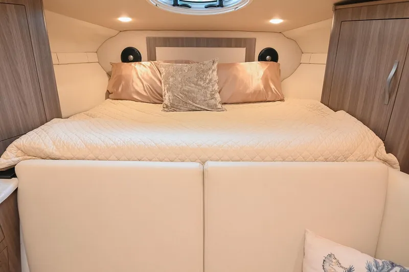Slide: The Image of Luxurious cabin interior of 2021 Regal 33 Express yacht with cozy bedding. - 44