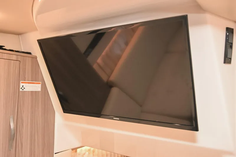 Slide: The Image of Flat-screen TV in 2021 Regal 33 Express cabin interior. - 47