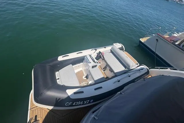 The Image of 2024 Williams Jet Tenders 345 Sports Jet docked on calm water. - 2
