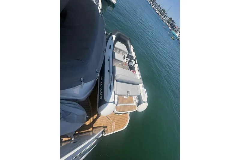 Slide: The Image of 2024 Williams Jet Tenders 345 Sports Jet moored on calm water. - 3