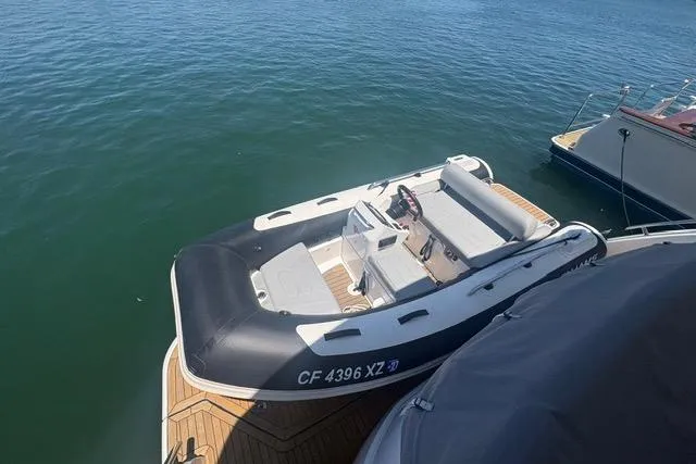 Slide: The Image of 2024 Williams Jet Tenders 345 Sports Jet moored on calm water. - 4