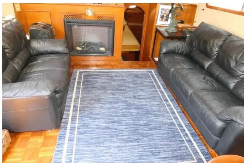 Slide: The Image of Interior of 1983 Chung Hwa Sedan Trawler with leather sofas and a fireplace. - 8