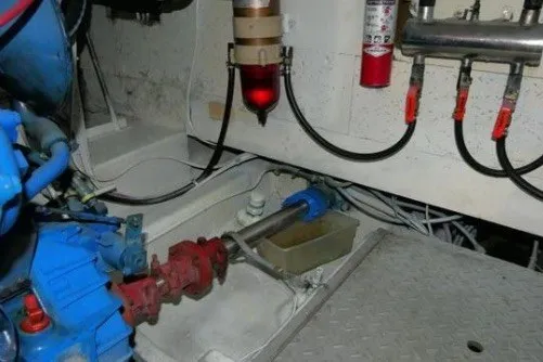 Slide: The Image of Engine room of 1983 CHB Sedan Trawler with visible machinery and components. - 20