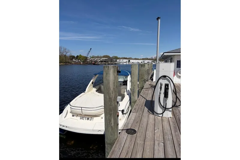 Slide: The Image of 2001 Sea Ray 290 Sun Sport docked at marina with fueling station. - 5