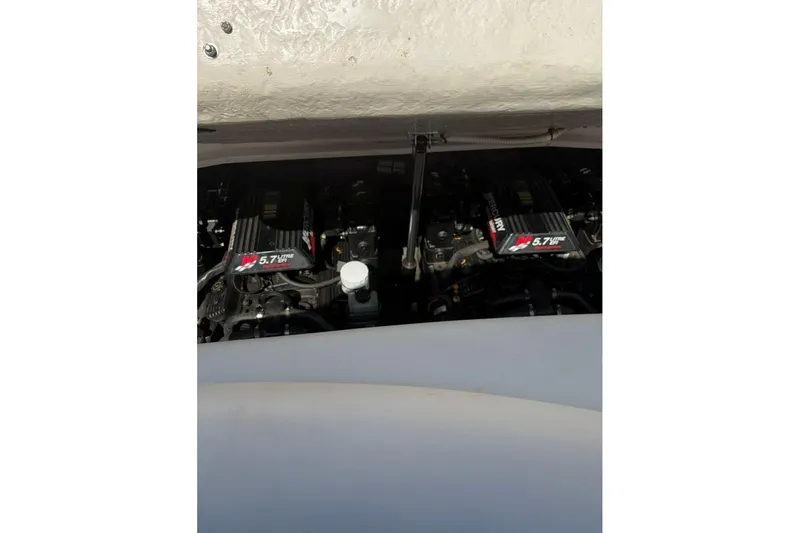 Slide: The Image of Engine compartment of a 2001 Sea Ray 290 Sun Sport boat, featuring dual 5.7L engines. - 7