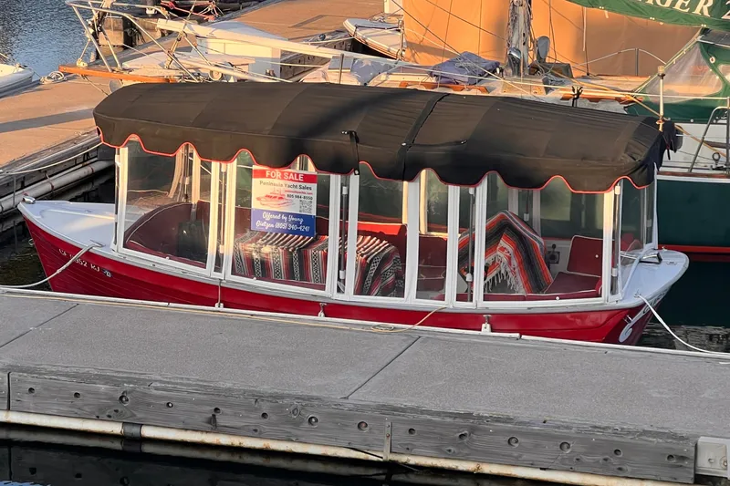 The Image of Red 2007 Duffy 16 boat with black canopy, docked and for sale at marina. - 1
