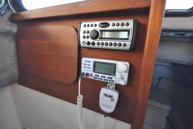 Slide: The Image of Control panel of a 2007 Ranger Tug R-25 with radio and navigation equipment. - 14