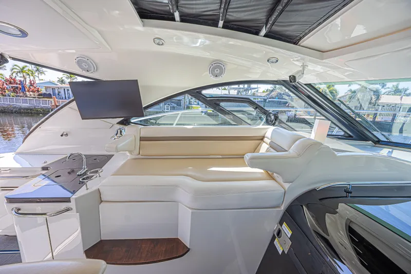 Slide: The Image of Luxurious interior of 2014 Sea Ray 410 Sundancer yacht with seating and entertainment system. - 18